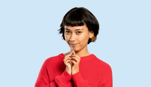 Short Hair Girl Red Sweater Scheming Something Isolated Blue Background — Stock Photo, Image