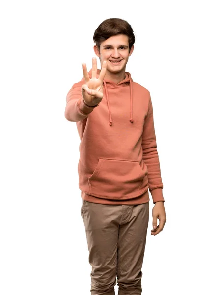 Dospívající Muž Mikinou Šťastný Počítání Tři Prsty Izolované Bílém Pozadí — Stock fotografie