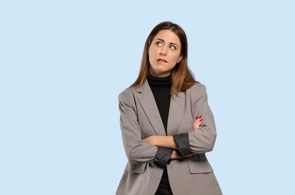 Business Woman Confuse Face Expression While Bites Lip Isolated Blue — Stock Photo, Image