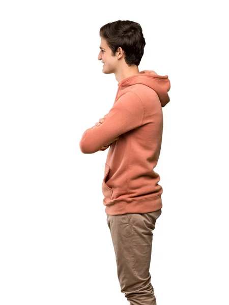 Teenager Mann Mit Sweatshirt Seitlicher Position Über Isoliertem Weißem Hintergrund — Stockfoto