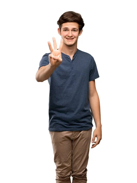 Adolescente Hombre Feliz Contando Tres Con Los Dedos Sobre Fondo — Foto de Stock