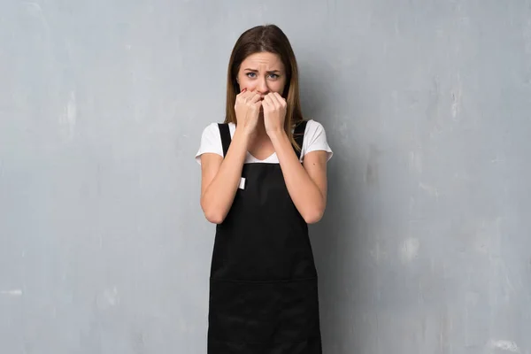 Employee woman nervous and scared putting hands to mouth