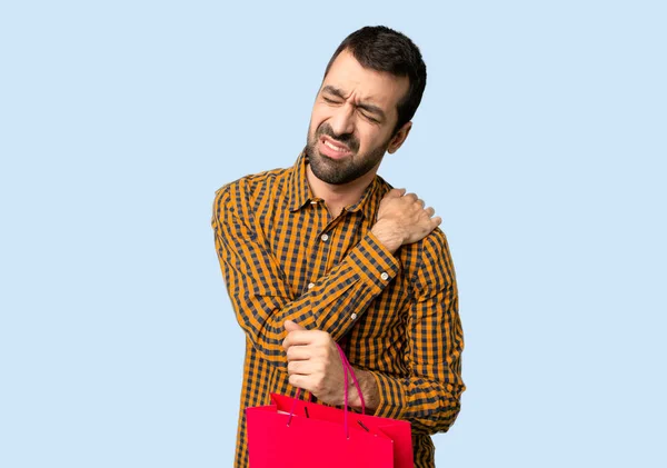 Homem Com Sacos Compras Sofrendo Dor Ombro Por Ter Feito — Fotografia de Stock