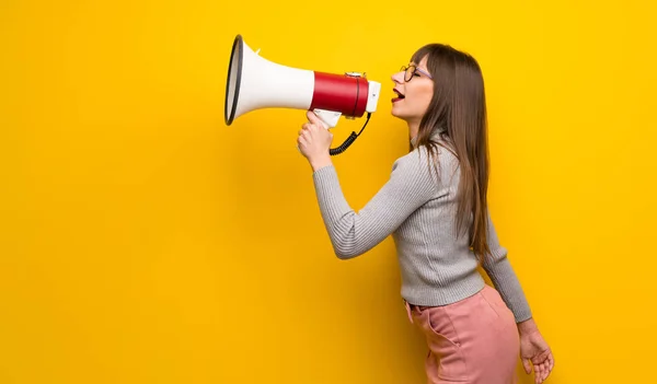 Woman Glasses Yellow Wall Shouting Megaphone Announce Something Lateral Position — Stock Photo, Image
