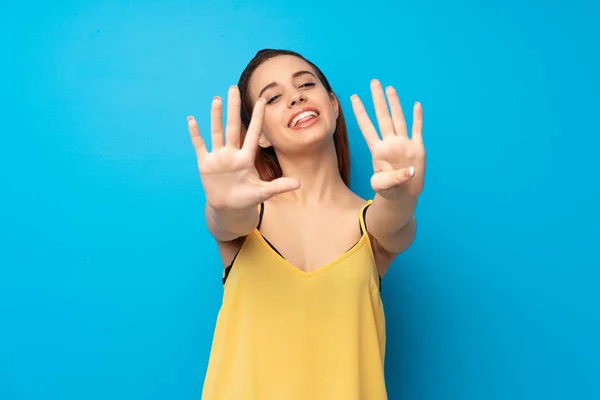 Young Redhead Woman Blue Background Counting Nine Fingers — Stock Photo, Image