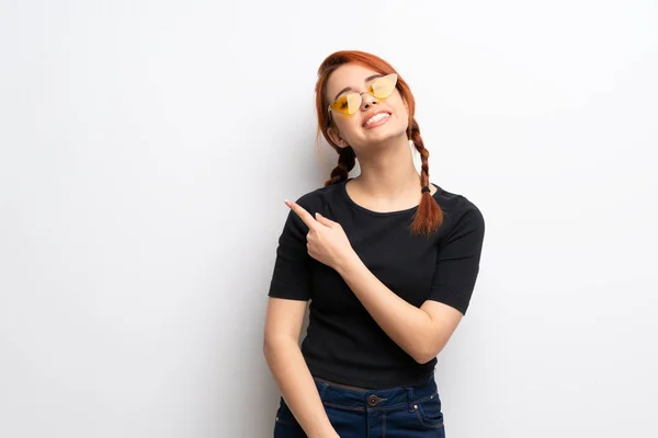 Young Redhead Woman White Wall Pointing Side Present Product — Stock Photo, Image