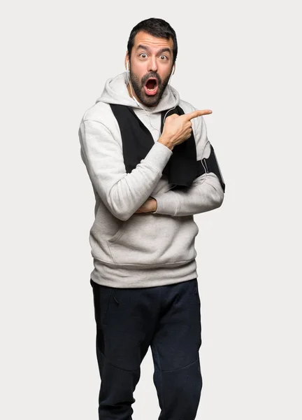 Sport Man Presenting Idea While Looking Smiling Isolated Grey Background — Stock Photo, Image
