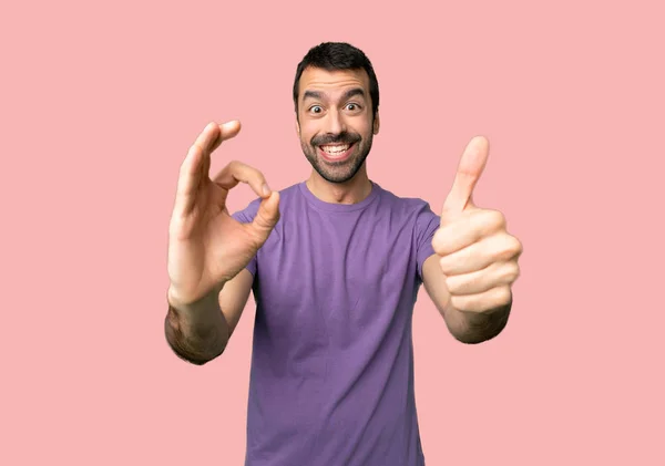 Handsome Man Showing Sign Giving Thumb Gesture Isolated Pink Background — Stock Photo, Image