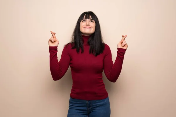 Young Woman Red Turtleneck Fingers Crossing Wishing Best — Stock Photo, Image