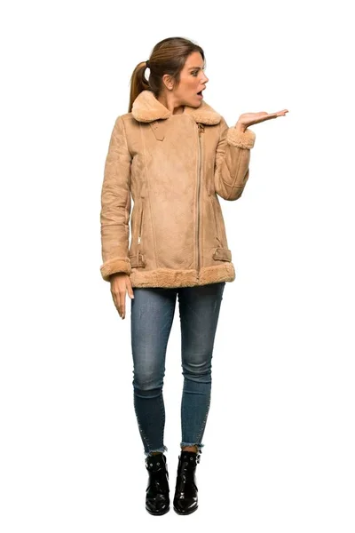 Full Length Shot Blonde Woman Coat Holding Copyspace Imaginary Palm — Stock Photo, Image