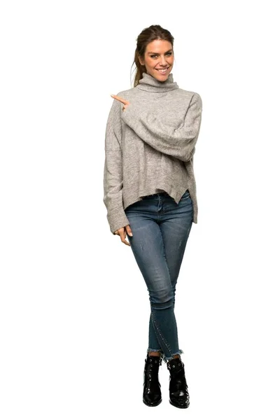 Full Length Shot Blonde Woman Turtleneck Pointing Side Present Product — Stock Photo, Image