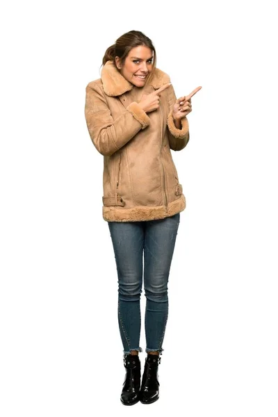 Full Length Shot Blonde Woman Coat Frightened Pointing Side Isolated — Stock Photo, Image