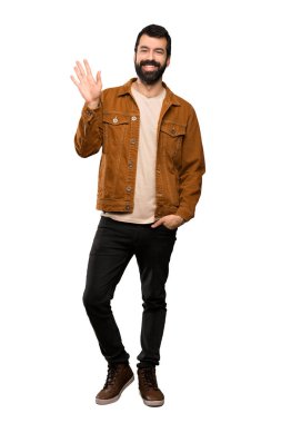 Sakal izole beyaz arka plan üzerinde el ile mutlu ifade ile selamlayan ile yakışıklı adam