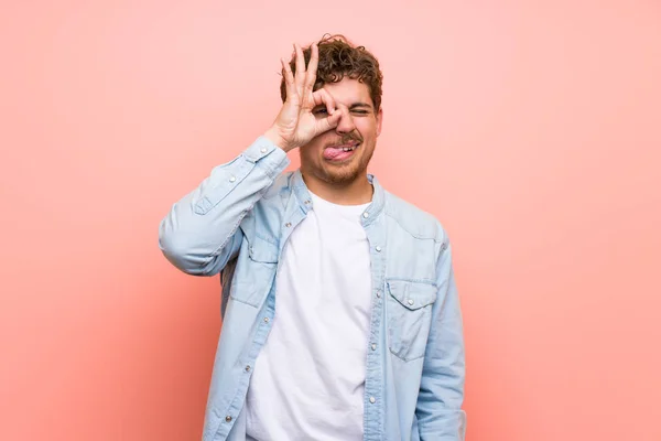 Blonde Man Pink Wall Makes Funny Crazy Face Emotion — Stock Photo, Image