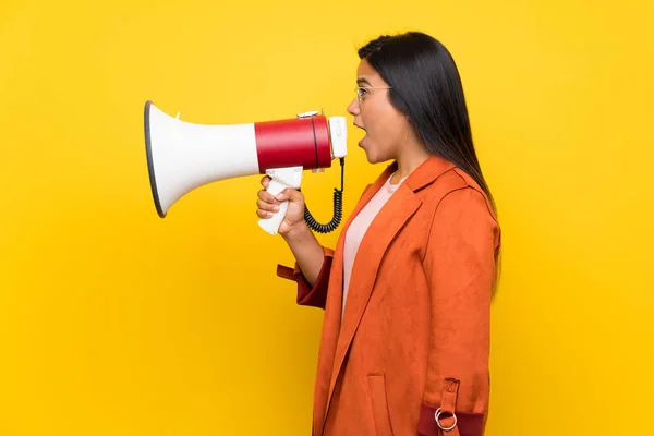 Young Colombian Girl Yellow Wall Shouting Megaphone — Stock Photo, Image