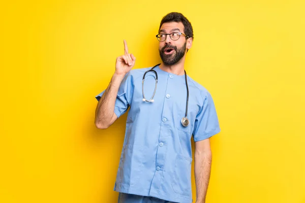 Surgeon Doctor Man Intending Realizes Solution While Lifting Finger — Stock Photo, Image