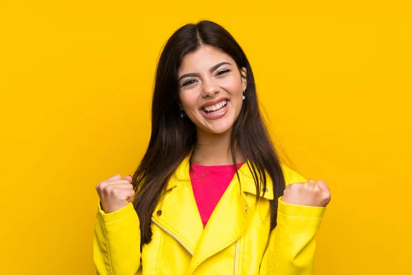 Adolescente Chica Sobre Amarillo Pared Celebrando Una Victoria —  Fotos de Stock