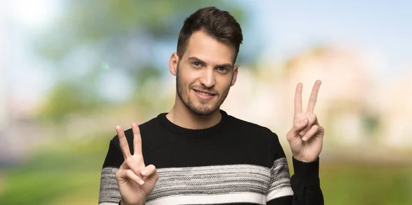 Handsome Man Smiling Showing Victory Sign Both Hands Outdoors — Stock Photo, Image