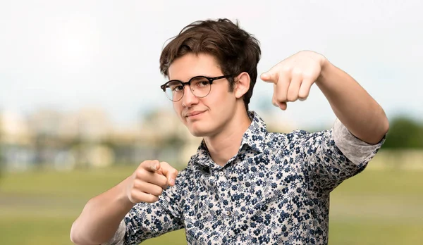 Teenager Man Flower Shirt Glasses Points Finger You While Smiling — Stock Photo, Image