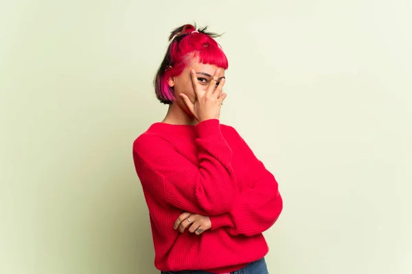 Young Woman Red Sweater Covering Eyes Hands Looking Fingers — Stock Photo, Image