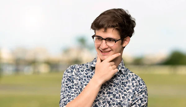 Teenager Man Flower Shirt Glasses Looking Side Outdoors — Stock Photo, Image