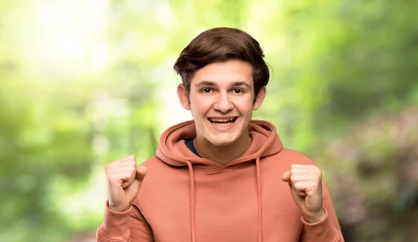 Teenager Man Sweatshirt Celebrating Victory Winner Position Outdoors — Stock Photo, Image