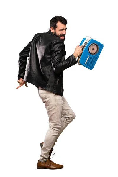 Homem bonito feliz com barba segurando um rádio — Fotografia de Stock