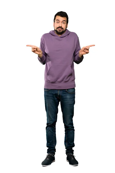 Full Length Shot Handsome Man Sweatshirt Pointing Laterals Having Doubts — Stock Photo, Image