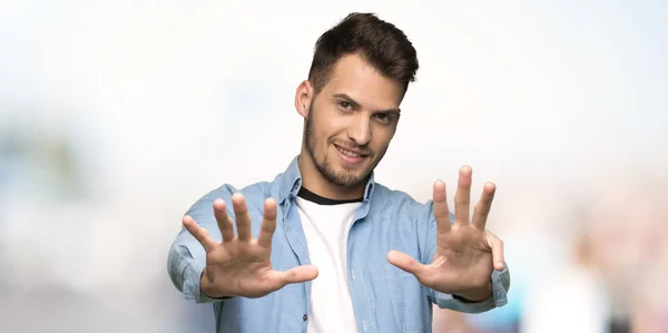 Handsome Man Counting Nine Fingers Outdoors — Stock Photo, Image