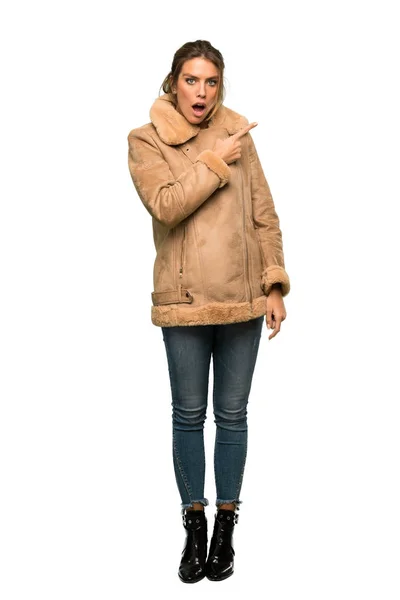 Full Length Shot Blonde Woman Coat Surprised Pointing Side Isolated — Stock Photo, Image