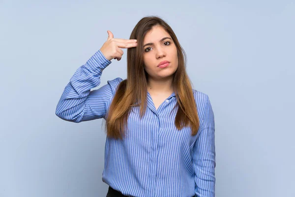 Young Girl Isolated Blue Wall Problems Making Suicide Gesture — Stock Photo, Image