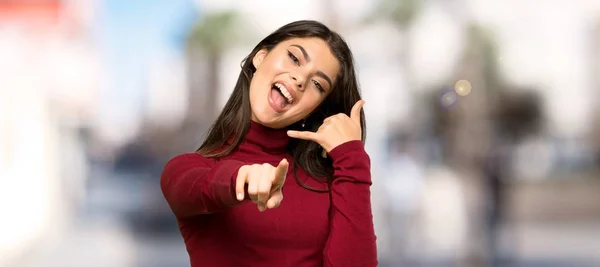 Teenager Girl Turtleneck Making Phone Gesture Pointing Front Outdoors — Stock Photo, Image