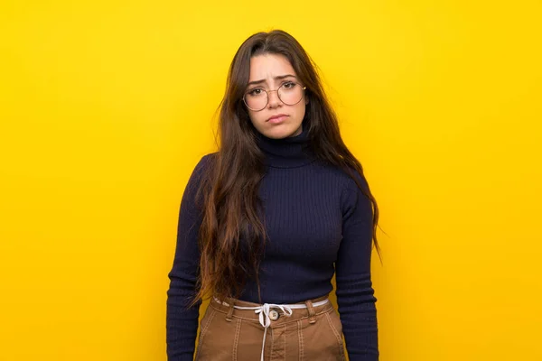 Teenager Girl Isolated Yellow Wall Sad Depressed Expression — Stock Photo, Image
