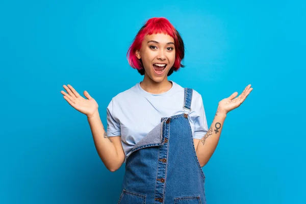 Young Woman Pink Hair Blue Wall Shocked Facial Expression — 스톡 사진