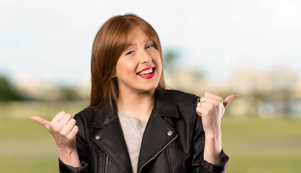 Young Redhead Woman Giving Thumbs Gesture Smiling Outdoors — Stock Photo, Image