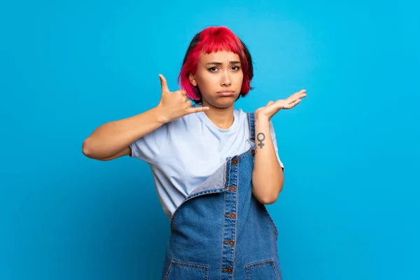 Young Woman Pink Hair Blue Wall Making Phone Gesture Doubting — 스톡 사진