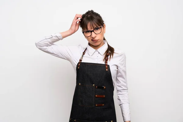 Young Woman Apron Having Doubts While Scratching Head — Stock Photo, Image