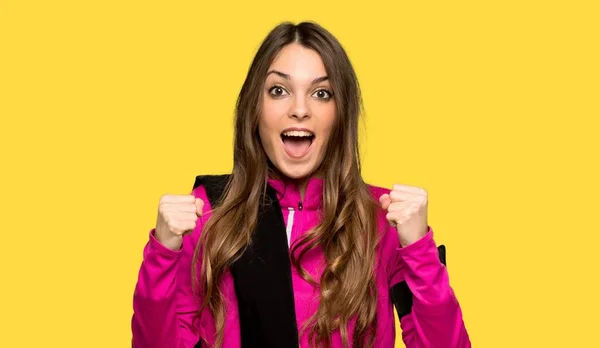 Young Sport Woman Celebrating Victory Winner Position Isolated Yellow Background — Stock Photo, Image