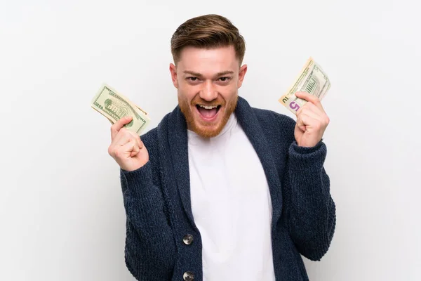 Pelirrojo hombre tomando un montón de dinero —  Fotos de Stock