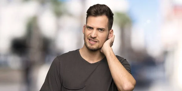 Man with black shirt having doubts at outdoors