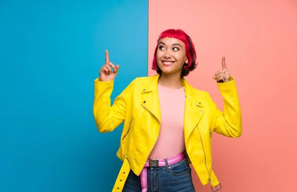 Young Woman Yellow Jacket Pointing Index Finger Great Idea — Stock Photo, Image