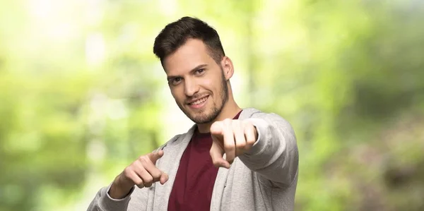 Man Sweatshirt Points Finger You While Smiling Park — Stock Photo, Image
