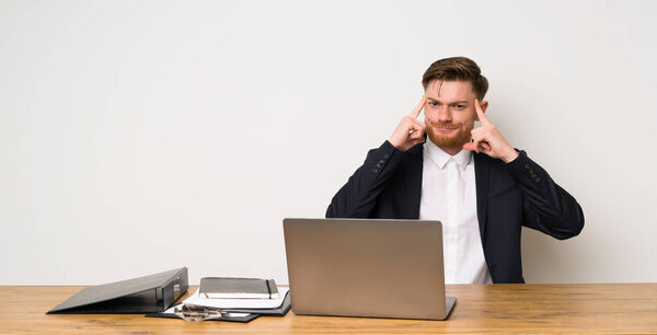 Businessman in a office having doubts and thinking