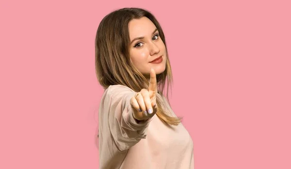 Teenager Girl Pink Sweater Showing Lifting Finger Isolated Pink Background — Stock Photo, Image