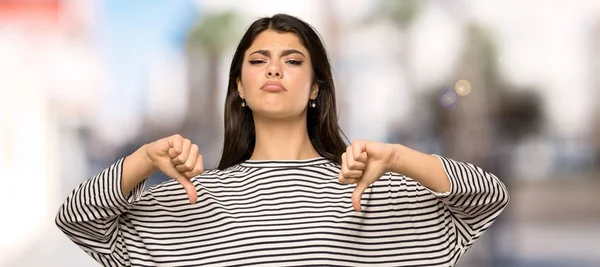 Teenager Girl Striped Shirt Showing Thumb Outdoors — Stock Photo, Image