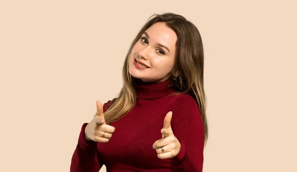 Teenager Girl Turtleneck Pointing Front Smiling Isolated Ocher Background — Stock Photo, Image