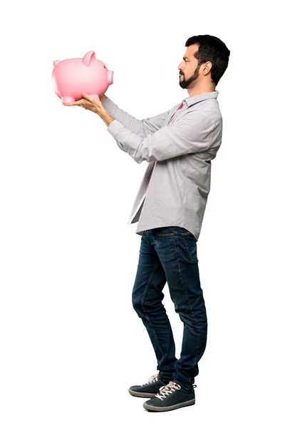 Tiro Cuerpo Entero Hombre Guapo Con Barba Sosteniendo Una Alcancía — Foto de Stock