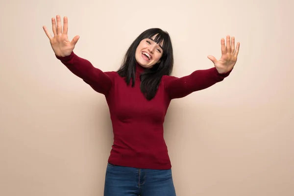 Young Woman Red Turtleneck Counting Ten Fingers — Stock Photo, Image