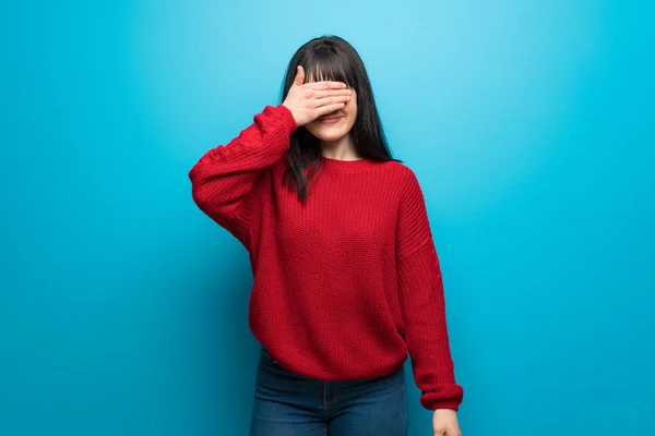 Woman Red Sweater Blue Wall Covering Eyes Hands Want See — 스톡 사진