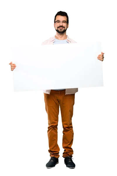 Tiro Completo Homem Bonito Com Barba Segurando Cartaz Vazio Sobre — Fotografia de Stock